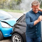 Mature-Male-Motorist-With-Whiplash-Injury-In-Car-Crash-Getting-Out-Of-Vehicle