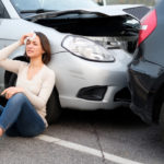 Injured girl after car accident in the street